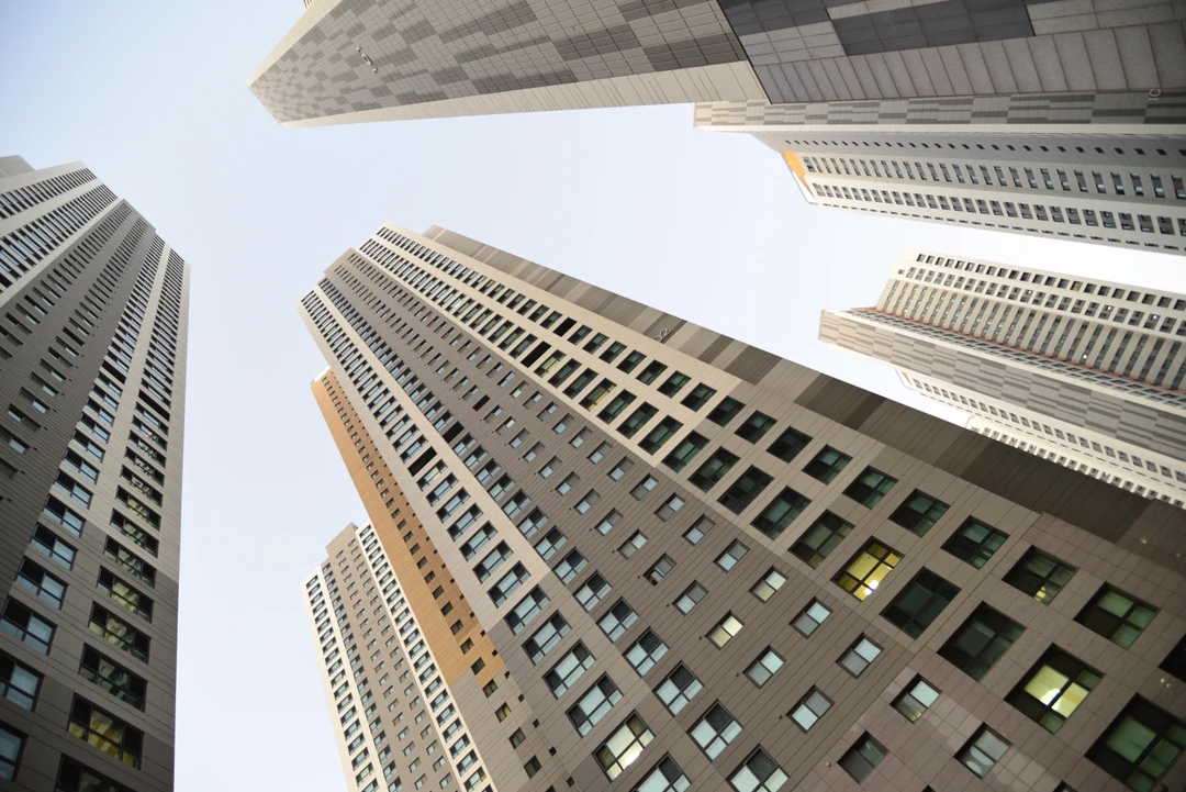 Original photo looking up between high-rise buildings